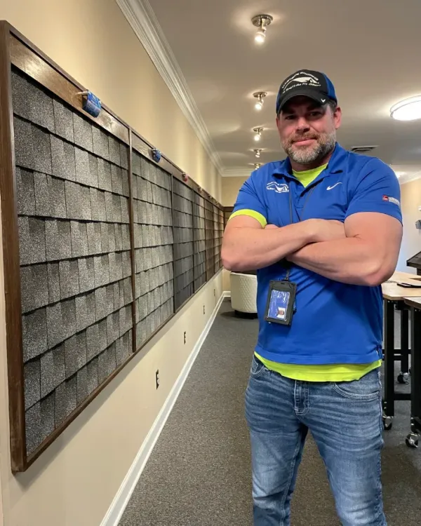 Robert Floyd in the Masters Roofing showroom.