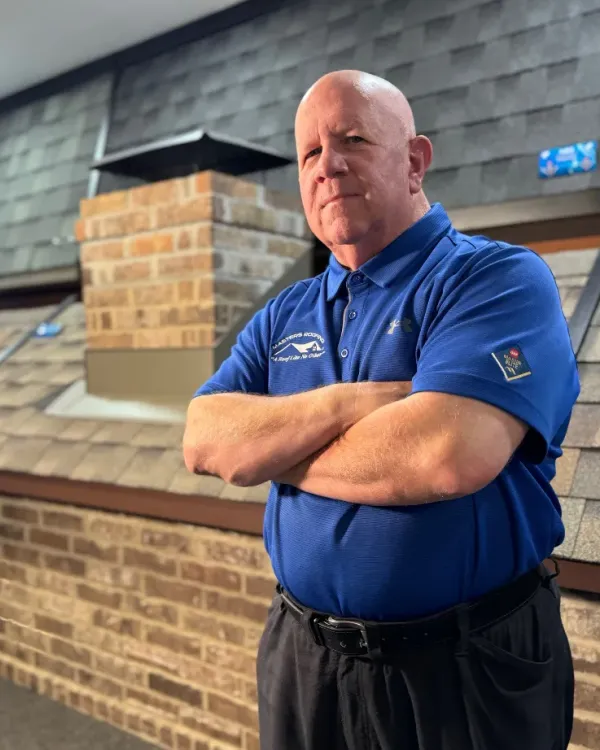Ed Hill in the Masters Roofing showroom.