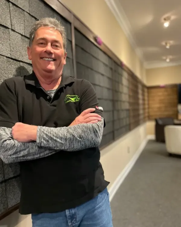 Dillon Scruggs in the Masters Roofing showroom.