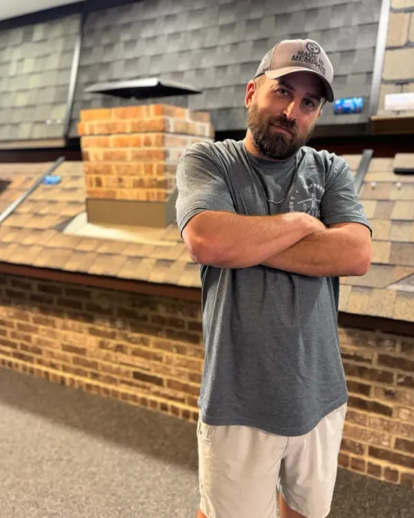 Chris Williams in the Masters Roofing showroom.