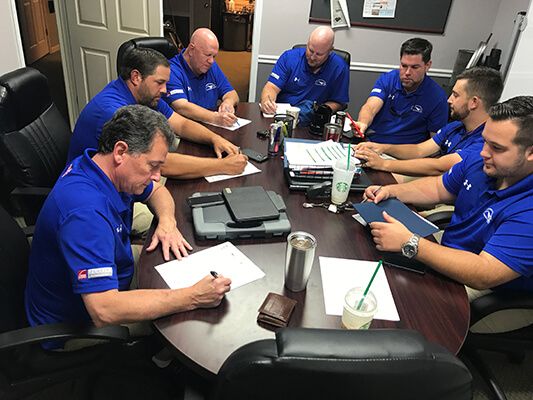 masters roofing team meeting