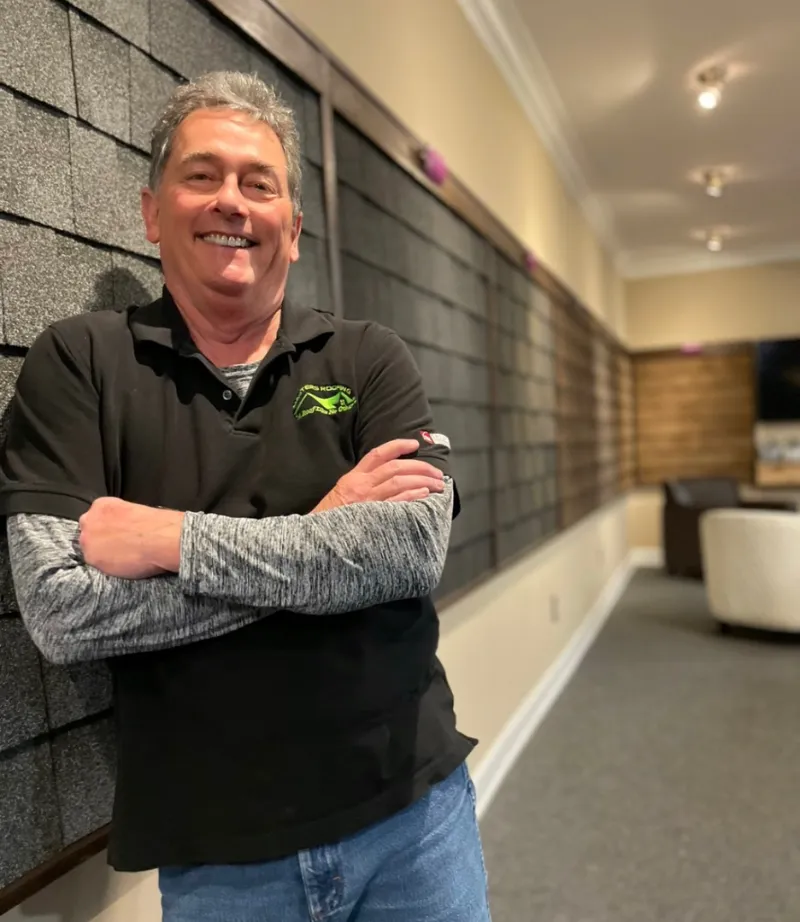 Dillon Scruggs in the Masters Roofing showroom.